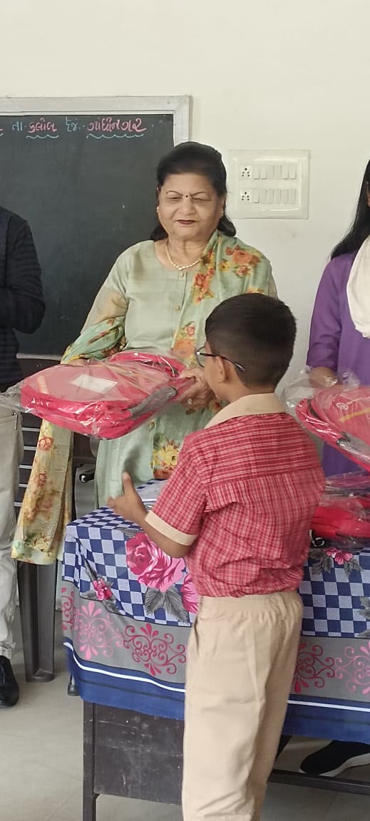 A child receiving footwear at a drive